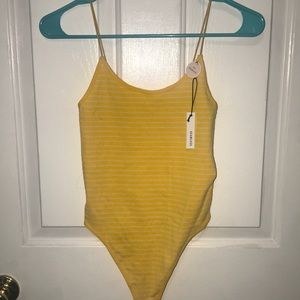 Yellow and white bodysuit